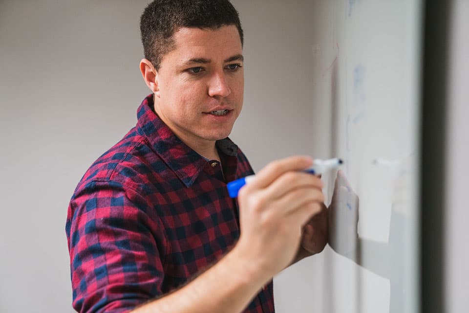 Isaiah McPeak at a whiteboard session